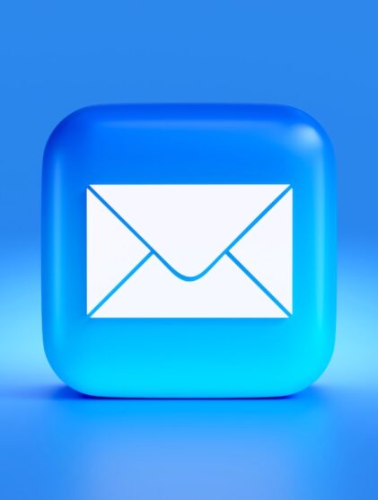 a blue button with a white envelope on it